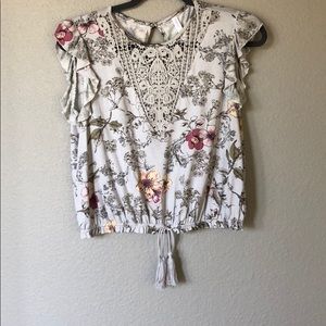 Floral top with lace detail and tassel bottom